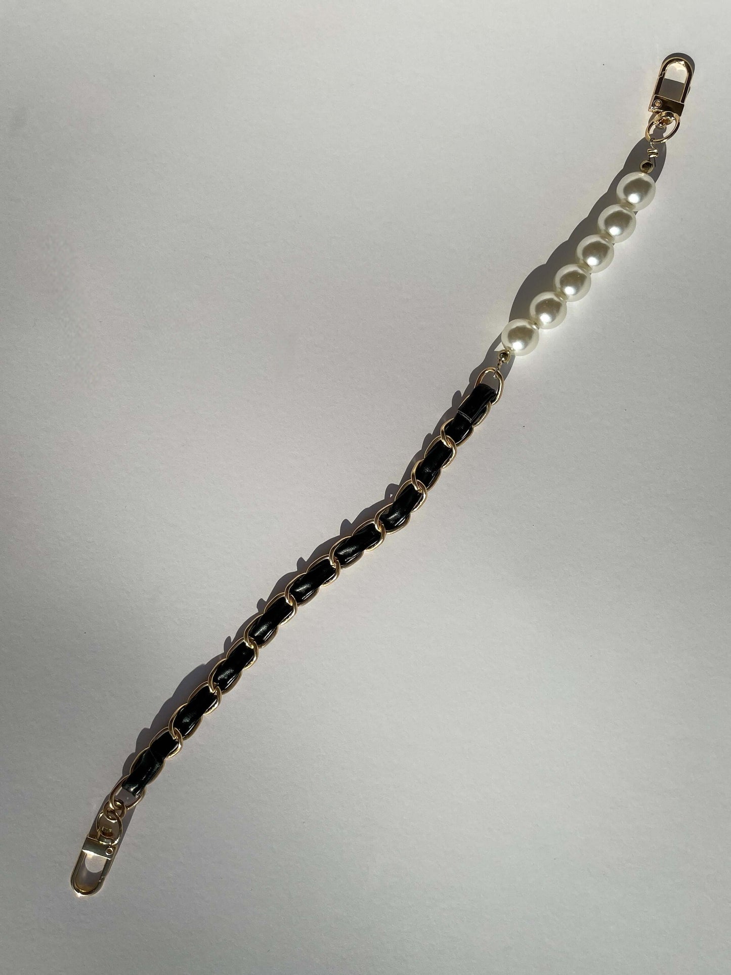 telefono deklas su perlais