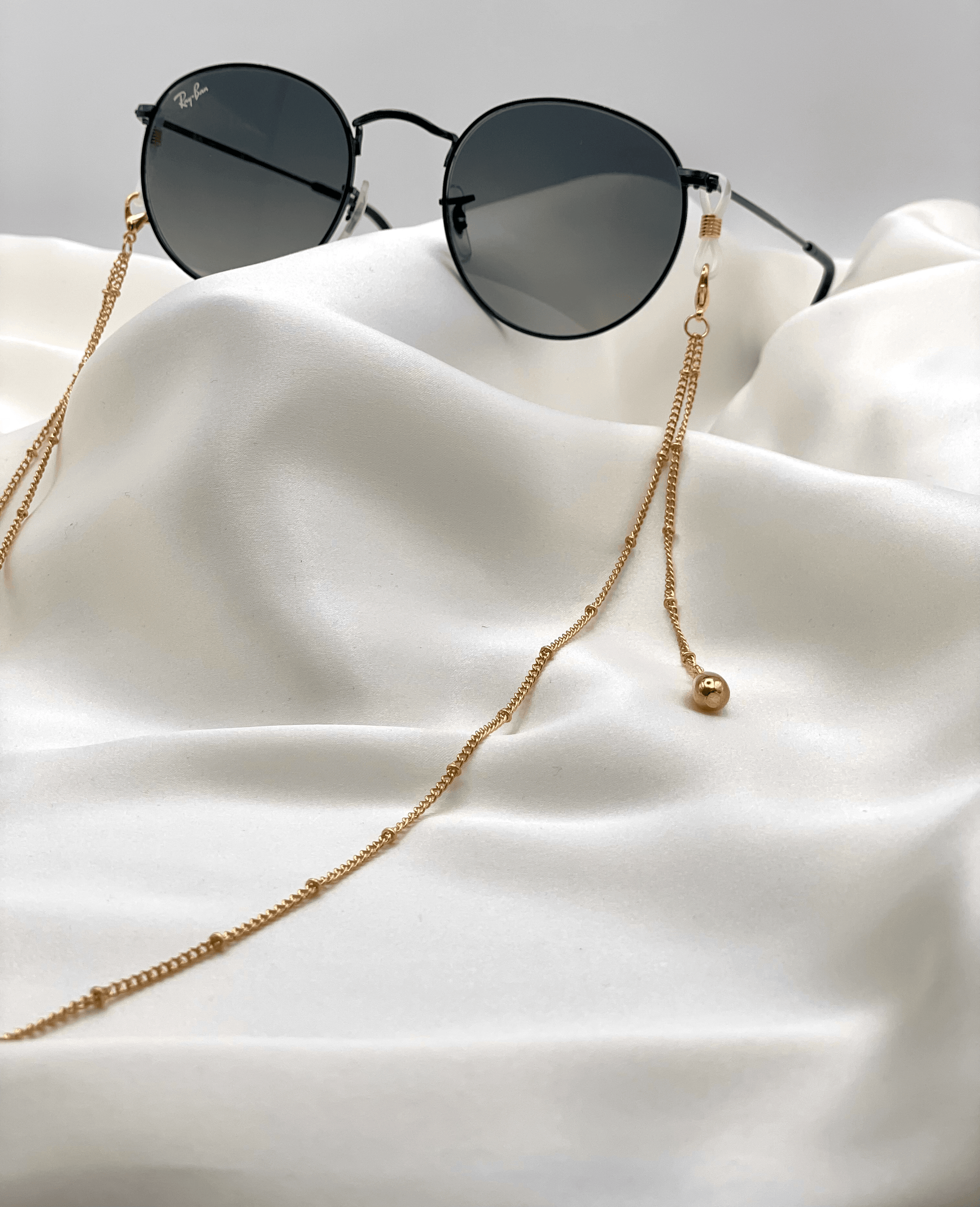 auksinė grandinėlė akiniams